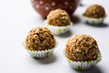 Oats laddu or Ladoo also known as Protein Energy balls. served in a plate or bowl. selective focus