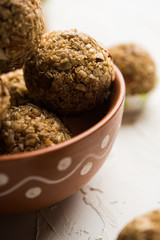Oats laddu or Ladoo also known as Protein Energy balls. served in a plate or bowl. selective focus