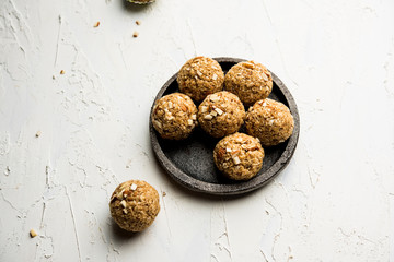 Oats laddu or Ladoo also known as Protein Energy balls. served in a plate or bowl. selective focus