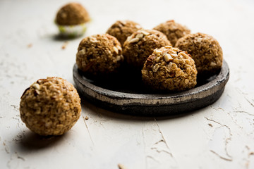 Oats laddu or Ladoo also known as Protein Energy balls. served in a plate or bowl. selective focus