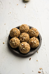 Oats laddu or Ladoo also known as Protein Energy balls. served in a plate or bowl. selective focus