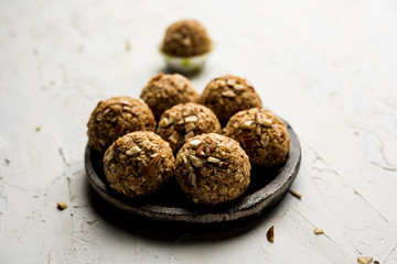 Oats laddu or Ladoo also known as Protein Energy balls. served in a plate or bowl. selective focus
