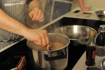 cooking tom yam in a saucepan