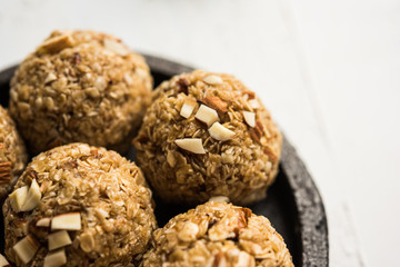 Oats laddu or Ladoo also known as Protein Energy balls. served in a plate or bowl. selective focus