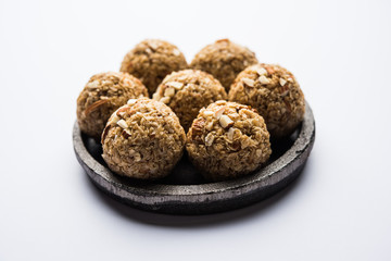 Oats laddu or Ladoo also known as Protein Energy balls. served in a plate or bowl. selective focus