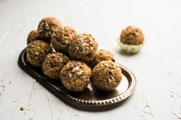 Oats laddu or Ladoo also known as Protein Energy balls. served in a plate or bowl. selective focus