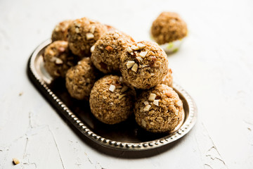 Oats laddu or Ladoo also known as Protein Energy balls. served in a plate or bowl. selective focus