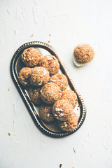 Oats laddu or Ladoo also known as Protein Energy balls. served in a plate or bowl. selective focus