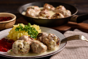 Swedish meatballs  with creamy gravy, mashed potatoes and lingonberry sauce.