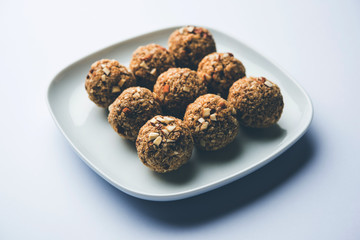 Oats laddu or Ladoo also known as Protein Energy balls. served in a plate or bowl. selective focus
