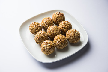 Oats laddu or Ladoo also known as Protein Energy balls. served in a plate or bowl. selective focus