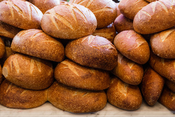 Fresh sourdough bread stacked in a bakery ready to sell and eat