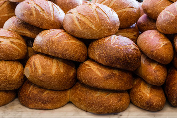 Fresh sourdough bread stacked in a bakery ready to sell and eat