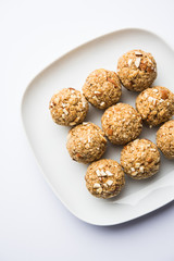 Oats laddu or Ladoo also known as Protein Energy balls. served in a plate or bowl. selective focus
