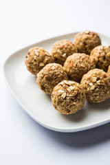 Oats laddu or Ladoo also known as Protein Energy balls. served in a plate or bowl. selective focus