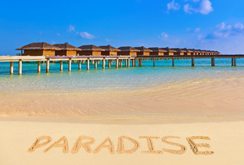 Word Paradise on beach