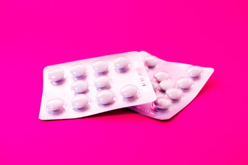 Tablets on a magenta background