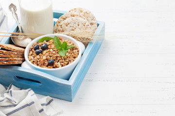 Healthy breakfast set with muesli, berries and milk