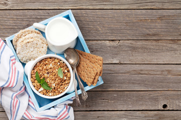 Healthy breakfast set with muesli, berries and milk