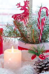 Merry Christmas! Magic gift box on the sill. Window decorated for holidays