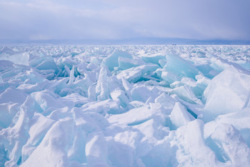 Fototapeta na wymiar Transparent Ice Lake Baikal similar to broken glass