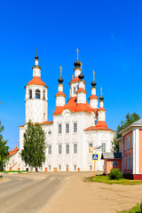 Russian white orthodox Temple of the Entry of the Lord into Jerusalem against the blue sky The Nativity Church, Totma, Russia. Architectural forms reminiscent of a ship.