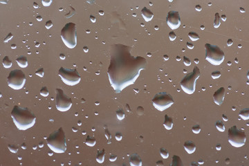 Abstract background texture of rain drops on a window
