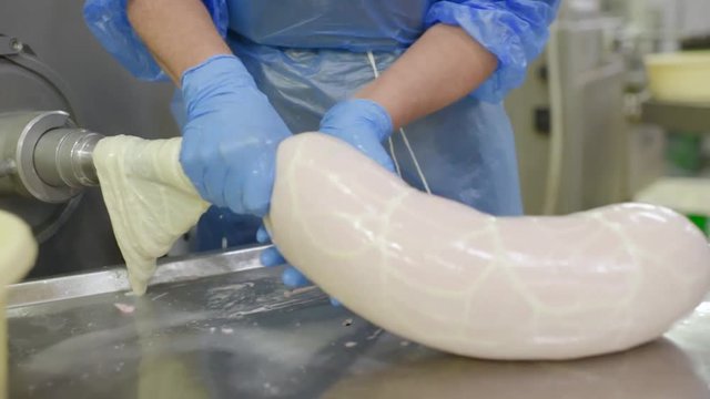 production of boiled sausages and smoked sausage at a meat factory. Food industry