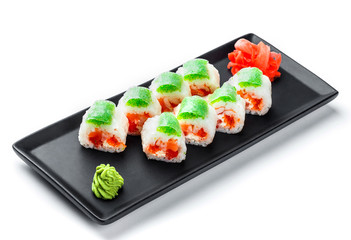 Sushi Roll - Maki Sushi with green and red caviar, Crab meat, salmon and cream cheese on black plate isolated over white background. Japanese cuisine