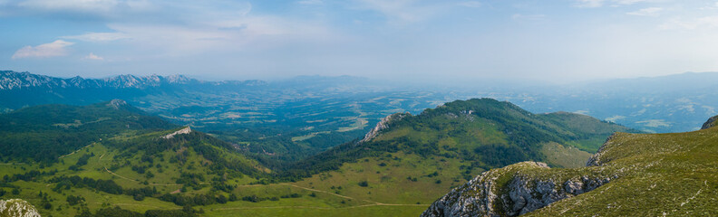Fototapeta na wymiar Landscape panorama on mountain peak in springtime