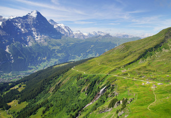 Fototapeta na wymiar Alpine peaks of Grindelwald and Jungfrau. Landskape background of Bernese highland. Alps, tourism, journey, hiking concept.