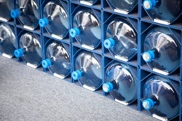 Rack of water cooler jugs