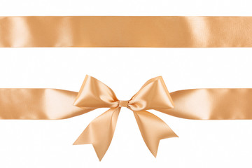Gold satin ribbon bow isolated on white background