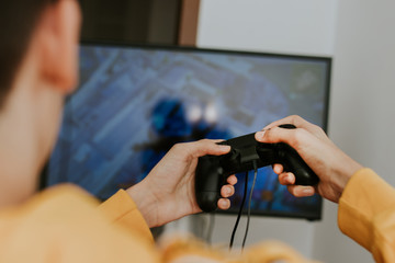 Obraz na płótnie Canvas hand with the joystick playing video games