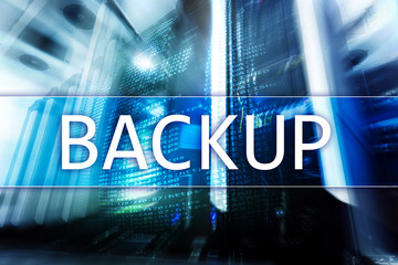 Backup button on modern server room background. Data loss prevention. System recovery. Server room