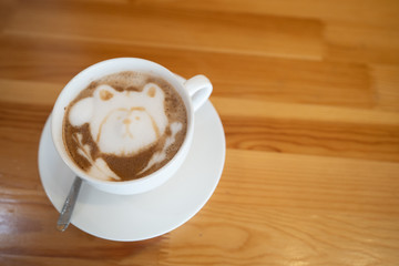 cup of coffee on wooden table