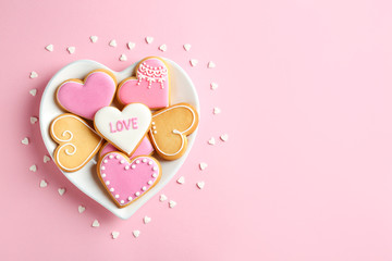 Flat lay composition with homemade heart shaped cookies and space for text on color background
