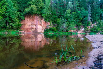 beautiful sandstone cliffs on the shores of river Amata in Latvia