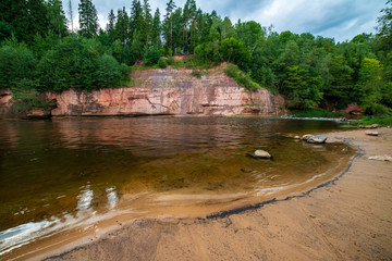 beautiful sandstone cliffs on the shores of river Amata in Latvia