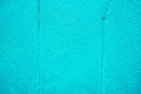The texture of plastered tiffany blue wall with joints, background