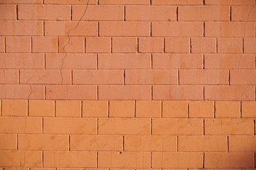 The texture of colored orange brick wall, background