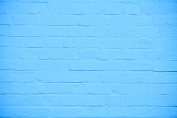 The texture of brick wall colored in blue, background