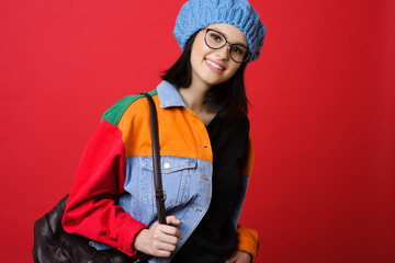 Trendy teenage woman with backpack
