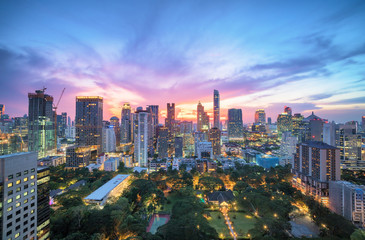 Fototapeta na wymiar Aerial view of Bangkok modern office buildings, condominium in Bangkok city downtown with sunset sky , Bangkok , Thailand