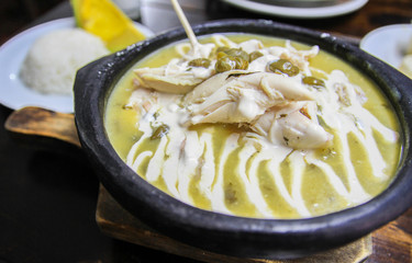 Ajiaco, a traditional stew made of chicken, corn and potatos, especially famous in Bogota,...
