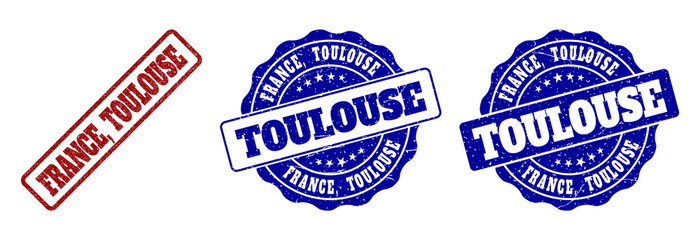 Obraz premium FRANCE, TOULOUSE grunge stamp seals in red and blue colors. Vector FRANCE, TOULOUSE marks with dirty style. Graphic elements are rounded rectangles, rosettes, circles and text tags.