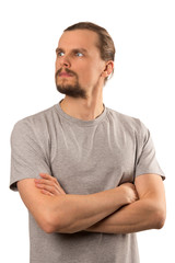 Bearded attractive caucasian guy looks away in surprise isolated on white