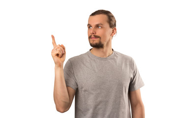 Fototapeta premium Bearded attractive caucasian guy holding forefinger up isolated on white
