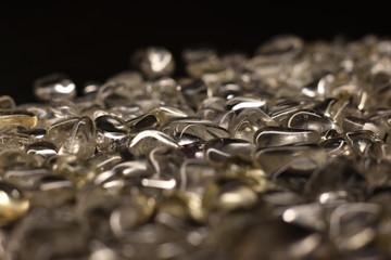a handful of quartz stones black background