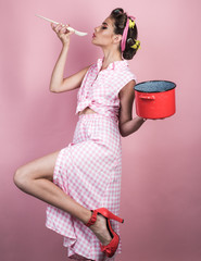 pinup girl with fashion hair. pin up woman with trendy makeup. perfect housewife. retro woman...